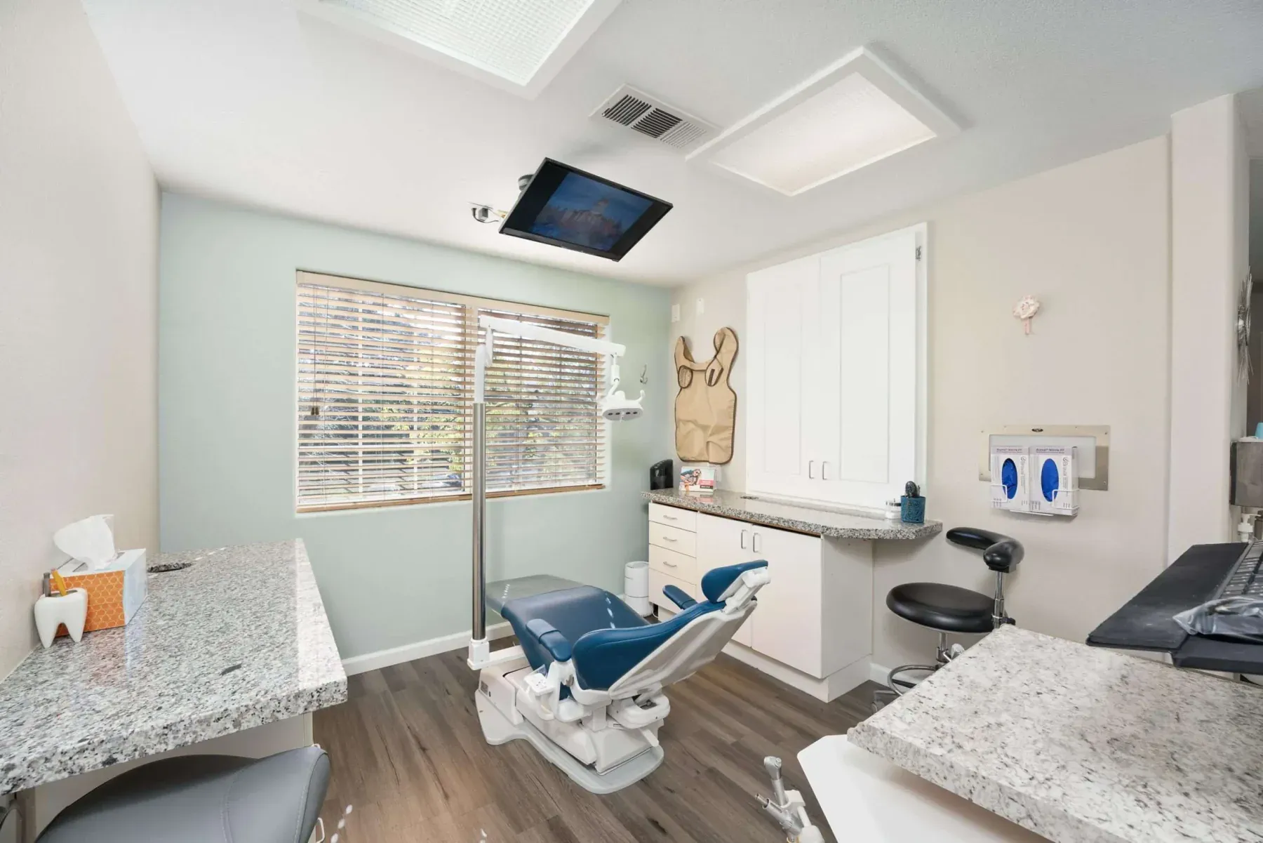 A treatment room with natural light and granite counters at Alta Vista Dental Care